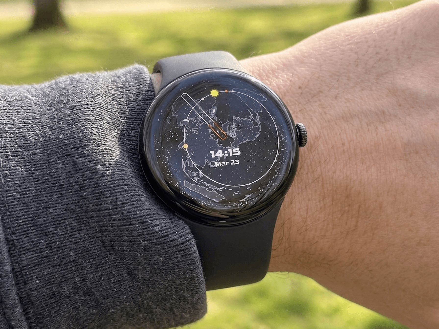 Spacetime Watch on wrist showing star map with planets